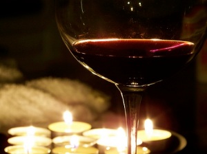 red-wine-in-a-wine-glass-with-tea-light-candles-By-quacktaculous-Brendan-DeBrincat